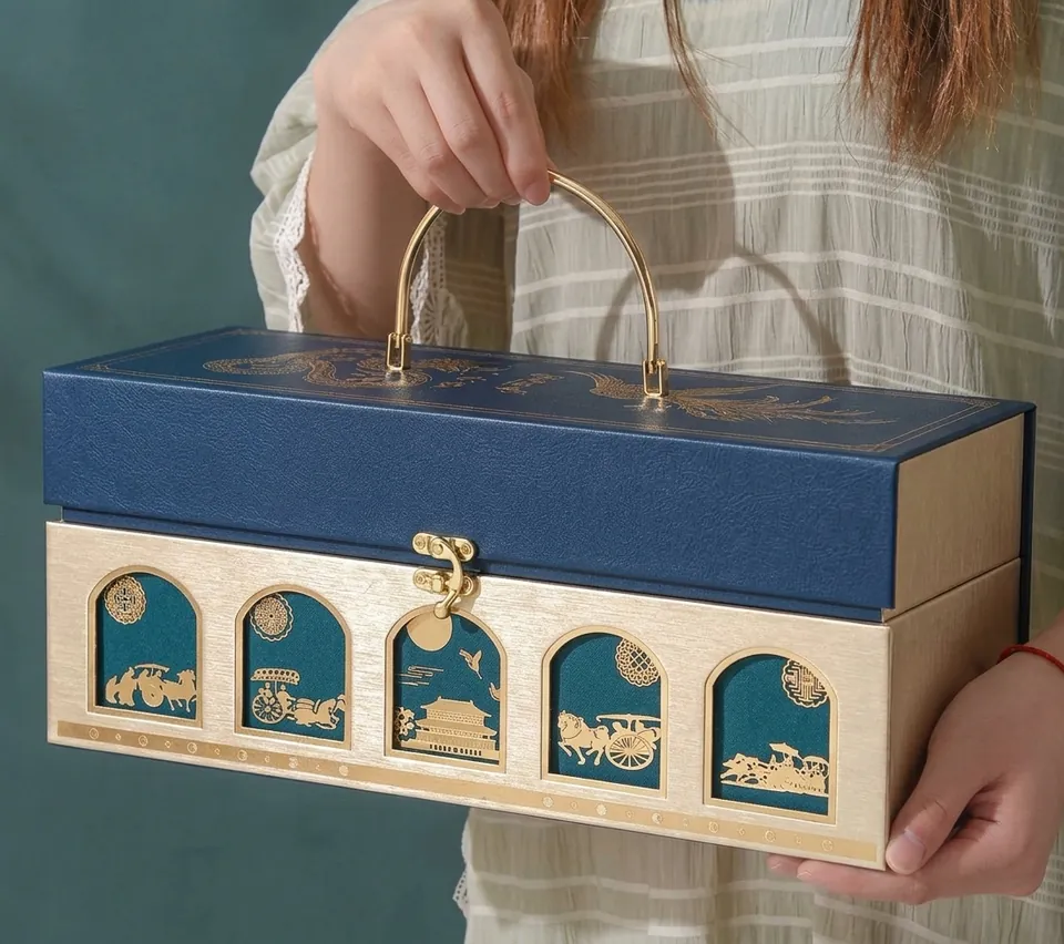 Blue and gold heritage trunk with arched windows and a brass handle